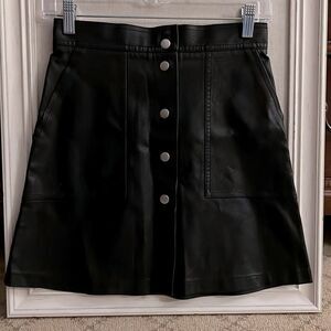French Black snap front faux leather skirt XS